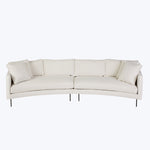 Modern sectional sofa with light upholstery and slim black legs.