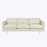 Sleek, modern three-cushion sofa in light beige fabric with metallic legs.