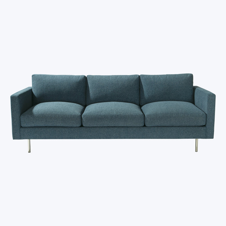 Modern three-seater sofa with minimalist design in dark teal/grey.