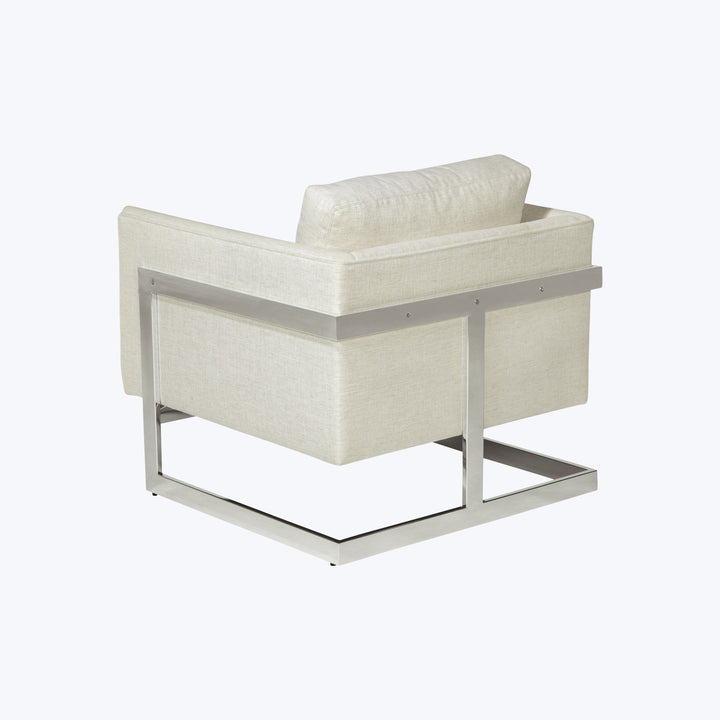Modern armchair with metal frame and light beige upholstery design.