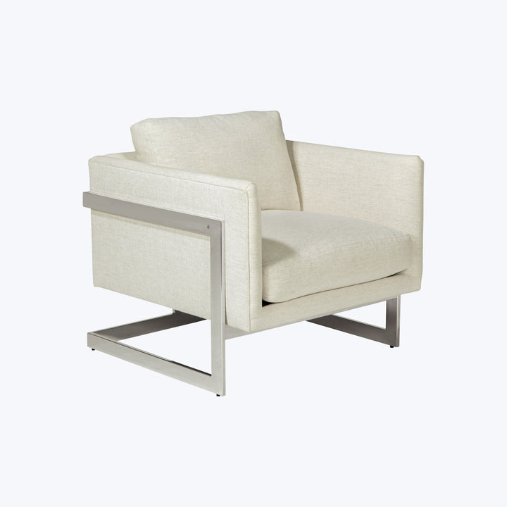 Modern armchair with textured fabric upholstery and sleek metallic frame.