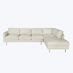 Modern sectional sofa with light upholstery and sleek metal legs