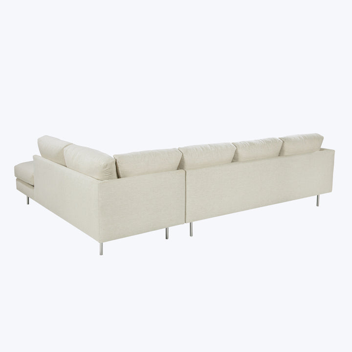 Modern sofa with clean design, light upholstery, metal pin legs