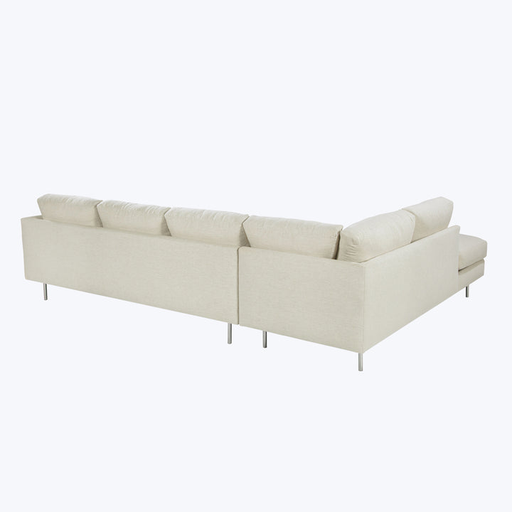 Modern sectional sofa with chaise, neutral fabric, minimalist design, metal legs.