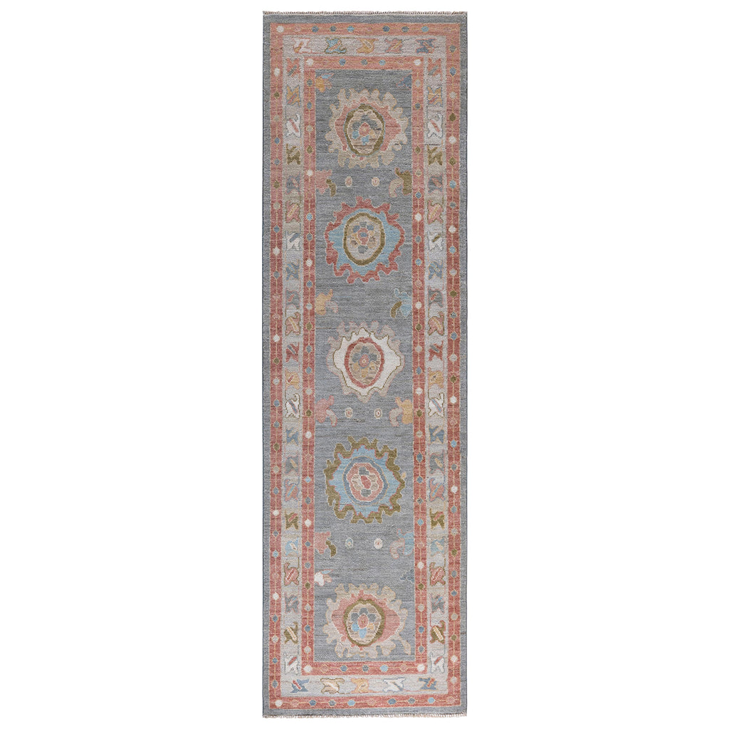 Vintage hall runner rug with ornamental medallions in warm tones.