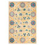 Ornate floral rug with intricate pattern in warm beige tones.