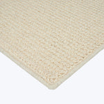 Close-up of plush loop pile rug in neutral beige color