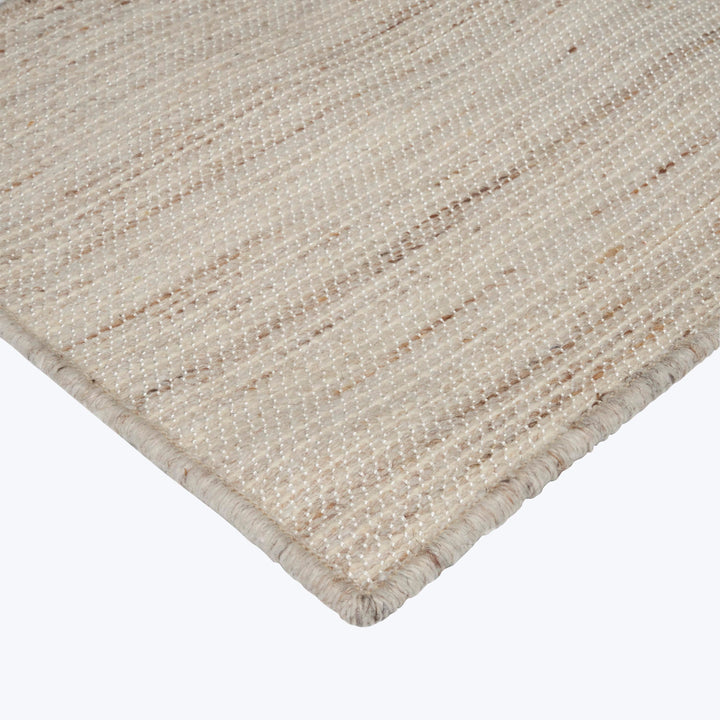 Modern beige striped rug with durable woven texture and bound edge