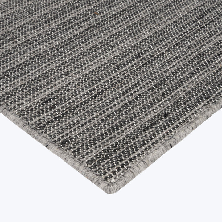 Close-up of durable woven fabric with grid pattern in neutral colors.