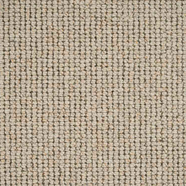 Close-up of loop pile carpet with neutral colors, durable design.