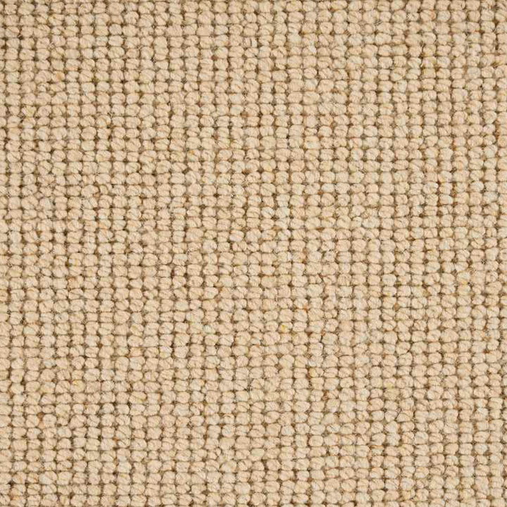 Close-up of neutral textured surface resembling fabric or carpeting pattern.