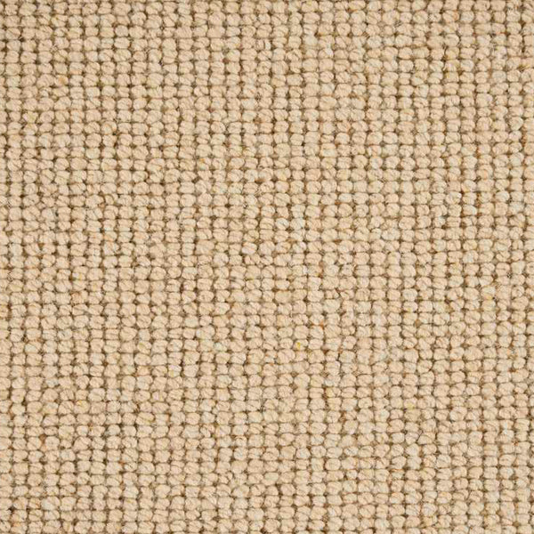 Close-up of neutral textured surface resembling fabric or carpeting pattern.