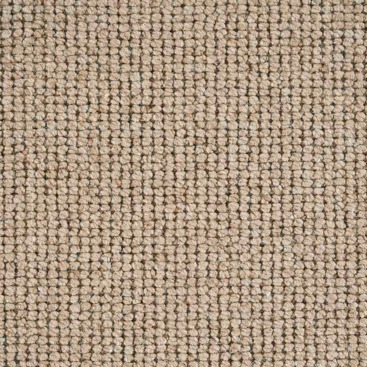 Close-up of textured fabric with tight weave in beige and brown.