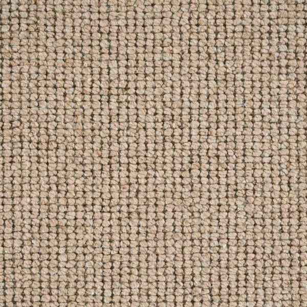 Close-up of textured fabric with tight weave in beige and brown.