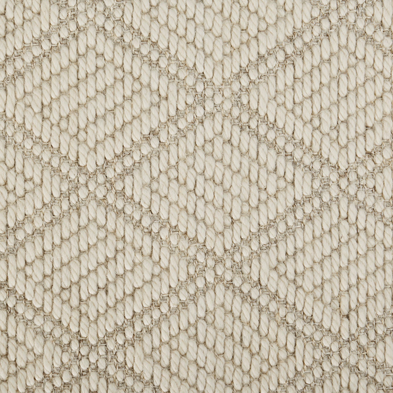 Detailed close-up of textured woven fabric with diamond pattern design.