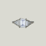 Contemporary Platinum Emerald Cut Diamond Ring;