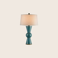 A close-up of a frosted glass mushroom-shaped lamp with a marble base.