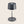 A small black table lamp with a simple cylindrical base and a black lampshade.
