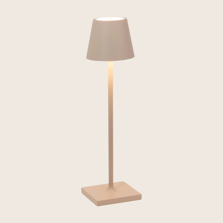 Beige table lamp with lit shade