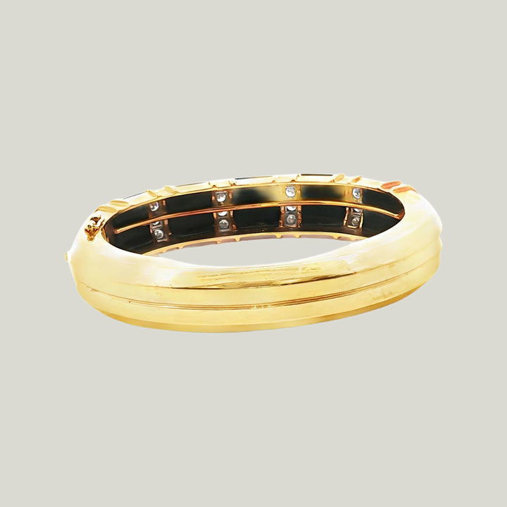 1980s American Onyx and Diamond Bangle in 18k Gold