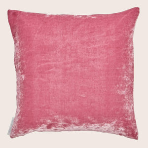 Square pink velvet pillow with slight shade variations, brand tag visible. - hover
