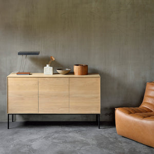 Modern wooden sideboard with sleek design, flush doors, black legs. - hover