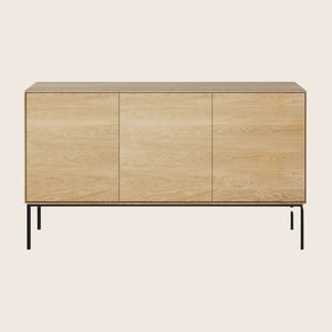 Modern wooden sideboard with sleek design, flush doors, black legs.