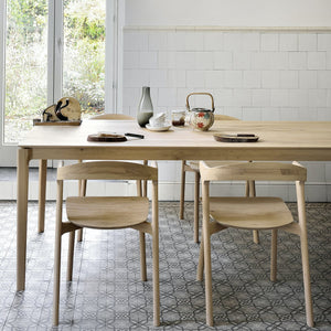 Minimalist wooden chair with sleek design and natural wood finish. - hover