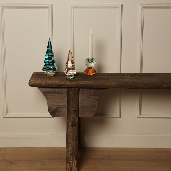 Rustic bench with decorative objects in peaceful vintage interior setting.