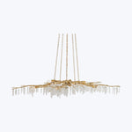 Elegant antique gold chandelier with crystal pendants on white background.