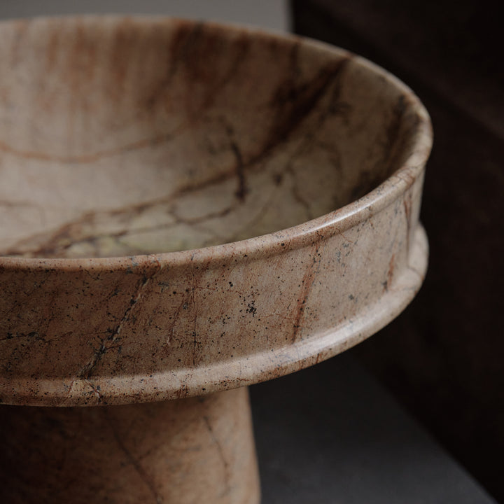 Handcrafted stoneware ceramic bowl with rustic texture and earthy colors.