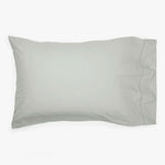 Soft, muted grey or green pillowcase with smooth, comfortable fabric.