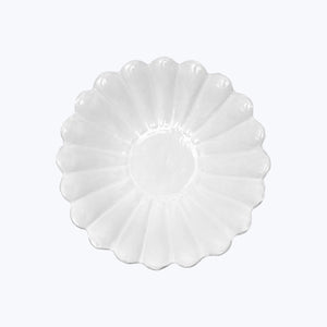 Scallop shell shaped dish with ridged pattern, glossy finish, decorative. - hover