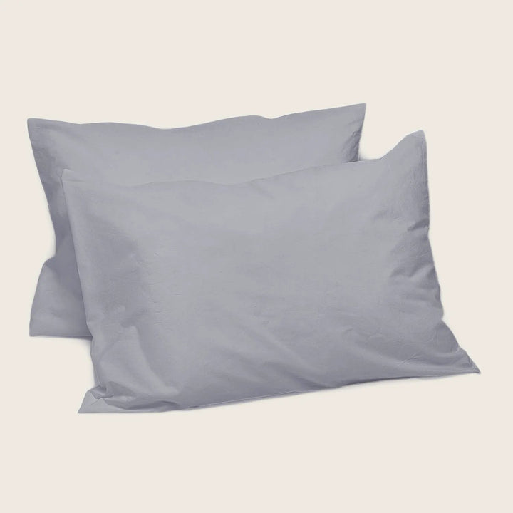 Two grey rectangular pillows with simple, clean design.