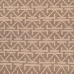 Geometric arrow-like pattern on off-white fabric with dark background.