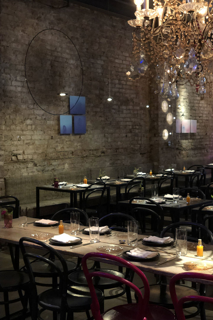 An intimate and stylish restaurant with rustic industrial decor.