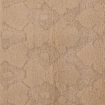 Soft, plush beige textured surface with swirling organic pattern design.