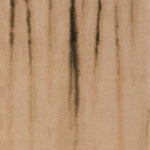 Close-up of textured surface with vertical streaks in warm beige.