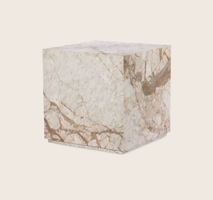 Cube with marble-like pattern in creamy hue, elegant and luxurious.