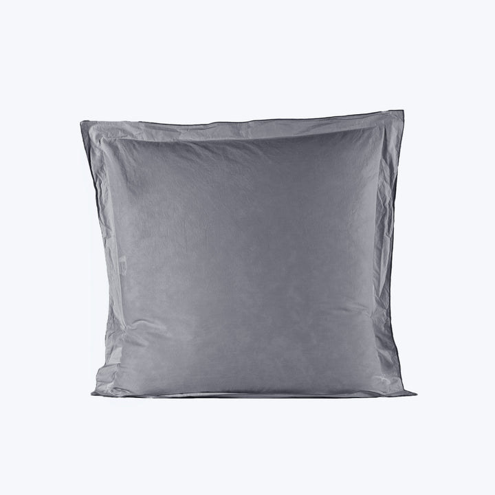 Single gray pillow on white background with visible seam detail.