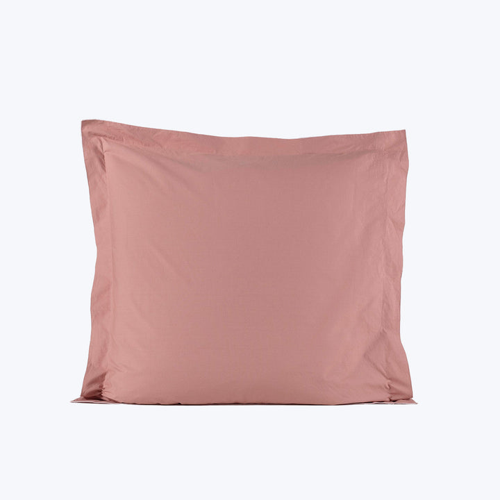Light pink square pillowcase for decorative use on couch or bed