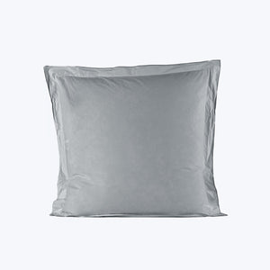 Two soft gray pillows stacked on white background, studio setting. - hover