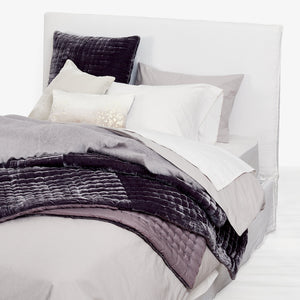 Neutral and cozy bedding set in soft, off-white tones. - hover