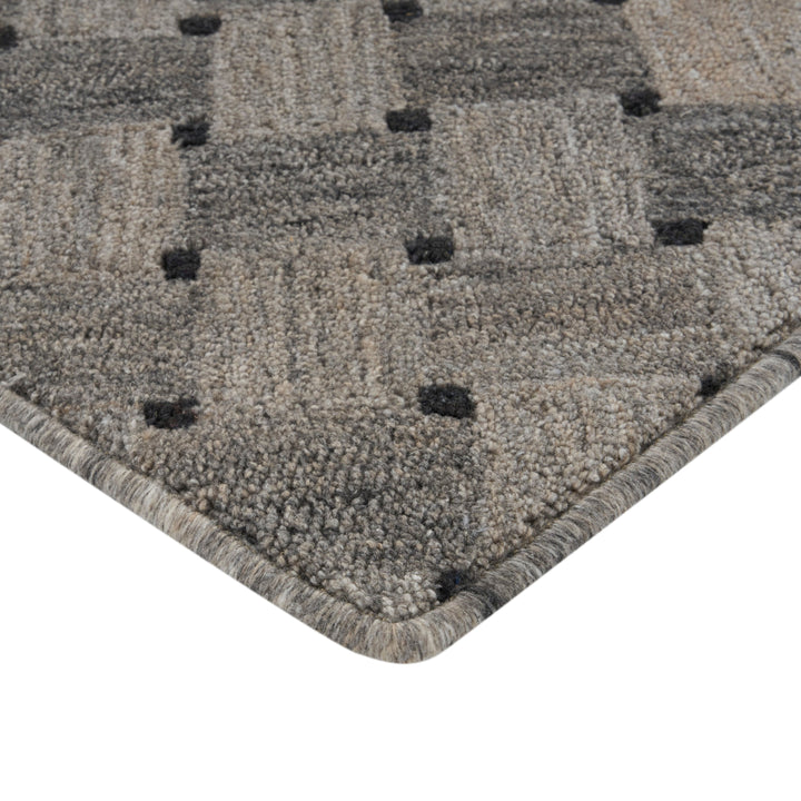 High-quality, plush gray carpet with textured pattern and finished edges.