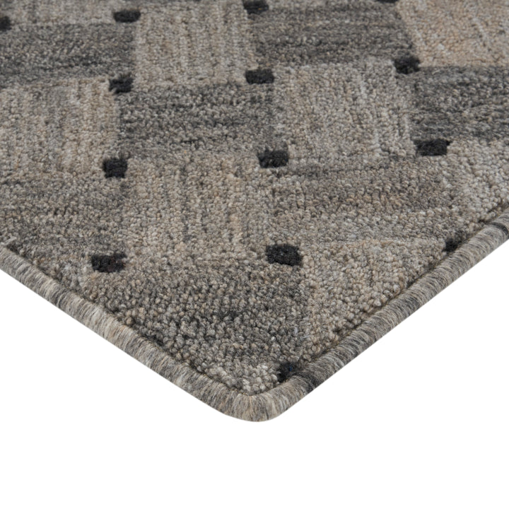 High-quality, plush gray carpet with textured pattern and finished edges.