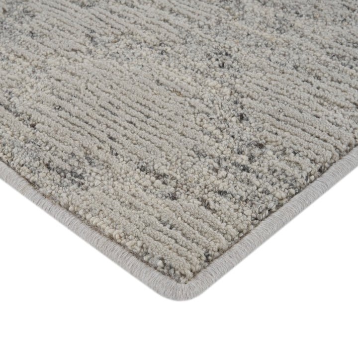 Close-up of gray and white textured area rug carpet detail.