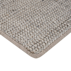 Close-up of loop pile textured carpet with bound edge detail. - hover