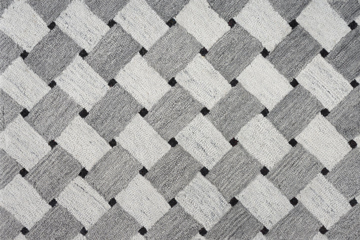 Close-up of textured fabric with geometric pattern in neutral colors.