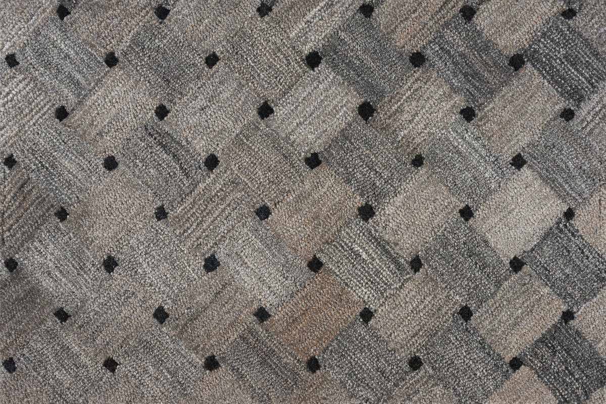 Close-up of textured fabric with diamond pattern in neutral tones.