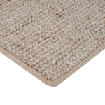 Close-up of loop pile textured carpet with bound edge detail.